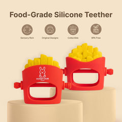 NomNom Fries teether in-hand view demonstrates comfortable grip for tiny fingers