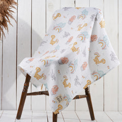 Honey Lullabies blanket shown as swaddle and nursing cover for versatility.