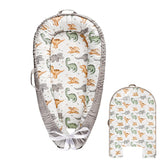 Hooyax baby lounger cover in dinosaur pattern on a cozy nest