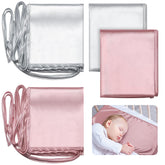 Hosuly satin bassinet sheet in pink with silky texture for gentle hair protection.