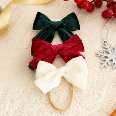 Hoyuwak Christmas bow red green white adds classic festivity to holiday outfits.
