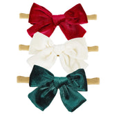 Hoyuwak velvet baby bow set enhances newborn outfits with soft texture and secure nylon headband.