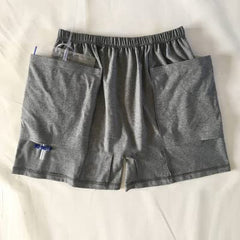 HUKSOSE shorts top view highlighting secure pocket opening for catheter stability.