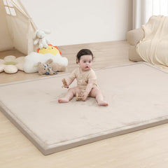 Huloo Sleep baby play mat in soft coral velvet for cozy tummy time.