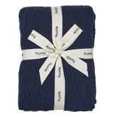 Huxie knitted baby blanket in organic cotton, exceptionally soft for newborn snuggles.