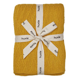 Huxie Knitted Baby Blanket Waves-Yellow close-up texture for gentle newborn skin contact.