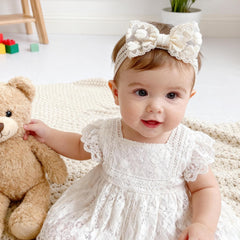 icke-you floral lace bow headband; charming accessory for christenings and birthdays.