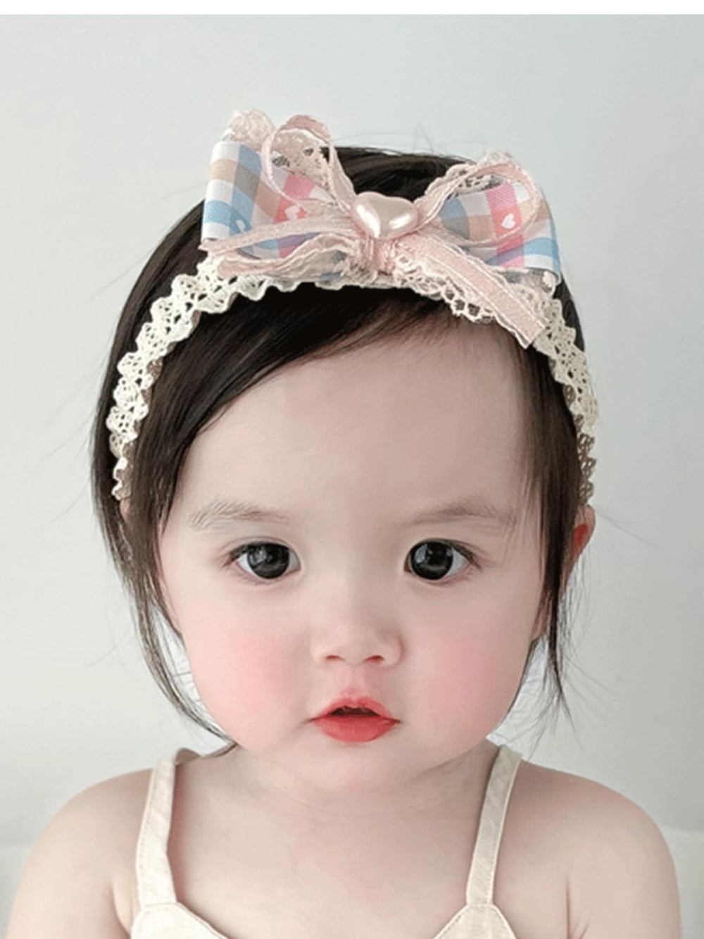 ICKEYOU baby hairband with pink bow, soft stretch ensures comfy all-day wear.