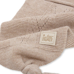 IDA KNITWEAR Cocoon Baby Blanket stone wrap demonstrates snug cocoon for calm newborns.