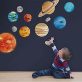iinuu Solar System Sun wall sticker creates a bold celestial focal point for kids' rooms.
