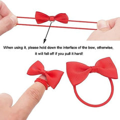 Two green bows for infants, gentle on fine hair and easy to wear.