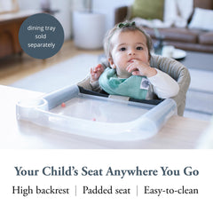 Inglesina Fast Table Chair Cream attached to a table for secure seating.
