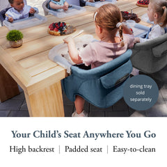 Inglesina Fast Table Chair attached to a table for convenient meals on the go.