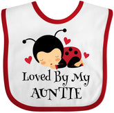 inktastic Loved By My Auntie Ladybug bib in white and red keeps baby clean during meals.