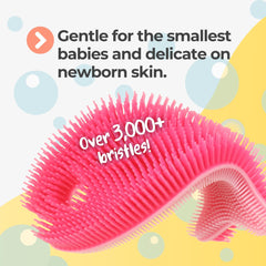 Innobaby Bathin' Smart Fish Scrub pink close-up highlighting silicone bristles for cradle cap exfoliation.