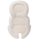 Innokids head-and-body-support-pillow in car seat providing a cozy cradle.