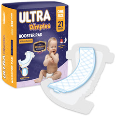 Inspire Ultra Dimples booster pad being applied with adhesive strip for secure placement.