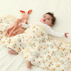 insular boho muslin blanket with four-sided tassels adds decorative warmth