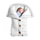 Insular warm baby sleeping bag with knitted wool exterior offers cozy warmth for winter outings.