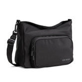 Itzy Ritzy Belong Cargo Caddy attached to a stroller for hands-free essentials on the go
