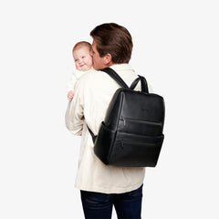 Itzy Ritzy Eras backpack back view highlights comfortable straps and trolley sleeve.