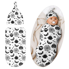 Jarverce Gothic swaddle blanket with pumpkin-bat pattern for newborn photos.