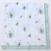 Jay & Ava Soft Cotton Muslin Blanket folded for easy warmth and breathability