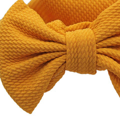 Jerague donut knot baby turban hat for easy outfit changes.