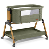Jimglo 3-in-1 bassinet in green shown as standalone sleep space for newborn comfort