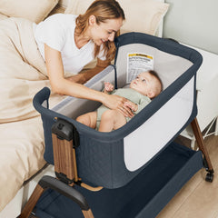 Jimglo bedside sleeper with side access keeps baby within arm's reach.