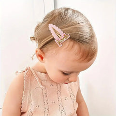 Jissoo glitter pink plush hair clip as a photo prop.