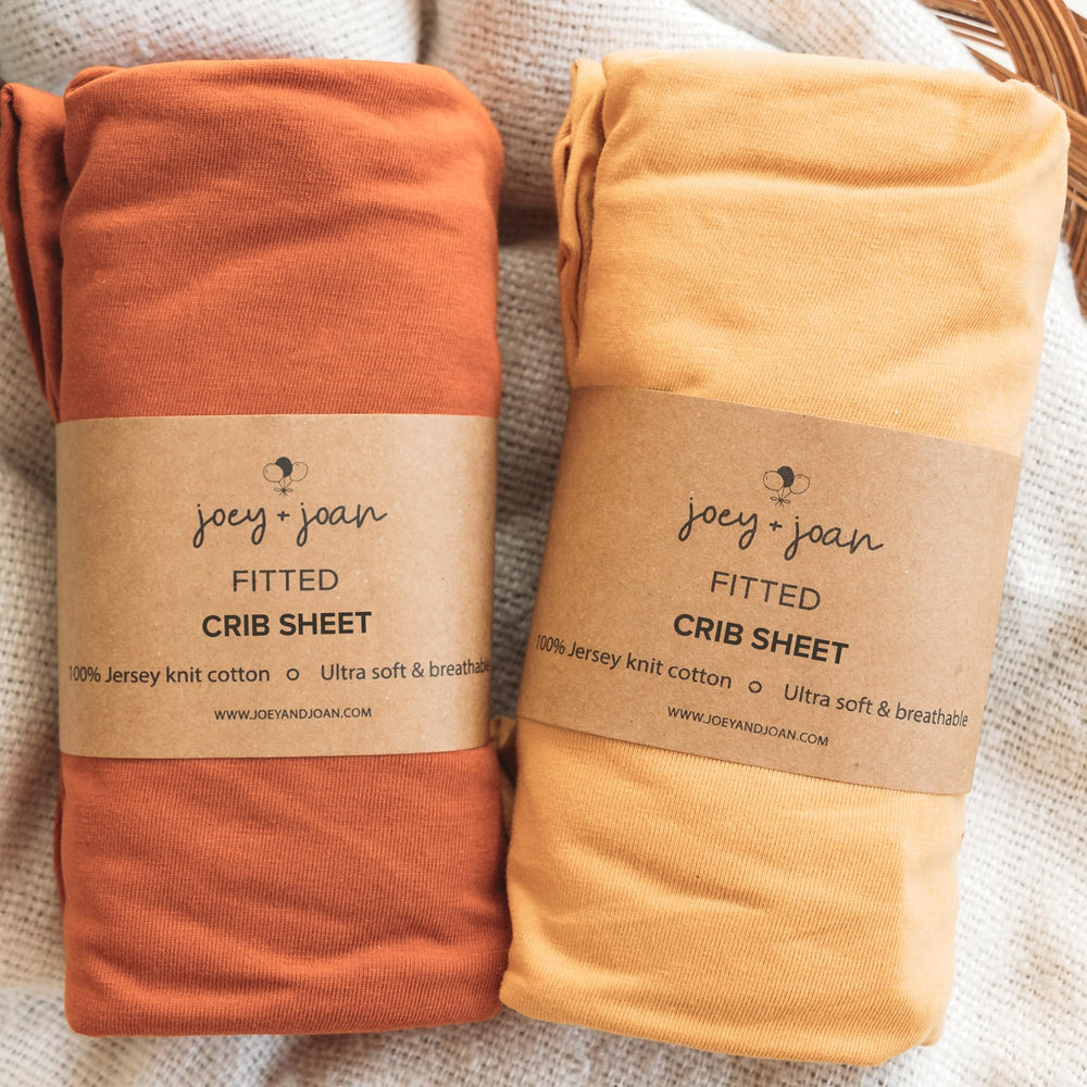 Joey + Joan fitted crib sheet on a standard 52x28 mattress showing a snug, silky surface