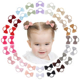 Jollybows 2-inch dark-set baby bows add color to outfits without pulling hair.