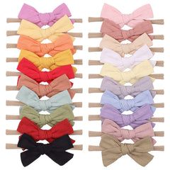 Jollybows baby bows on a cotton soft headband for gentle everyday wear.