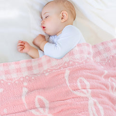 JOOJA pink bow baby blanket offers warm coverage for naps and stroller outings.