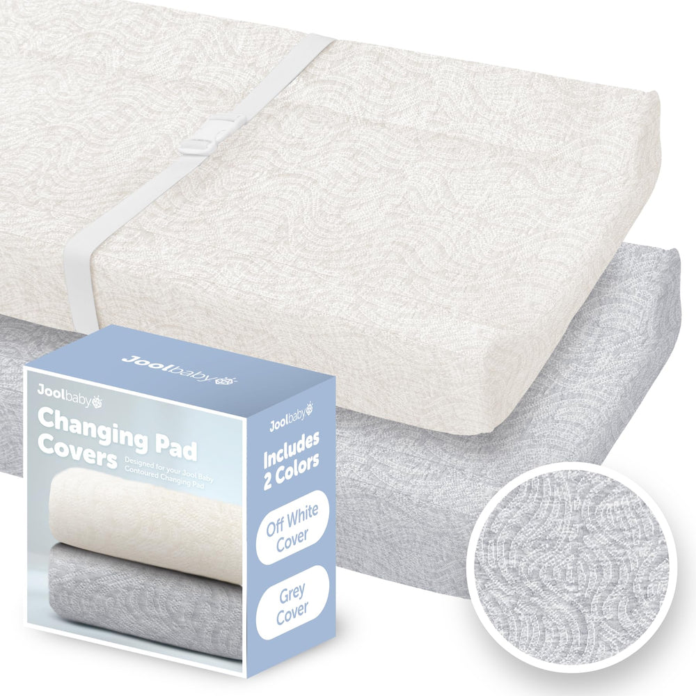 Jool Baby changing pad cover in off-white close-up showing soft fabric for gentle diaper changes.