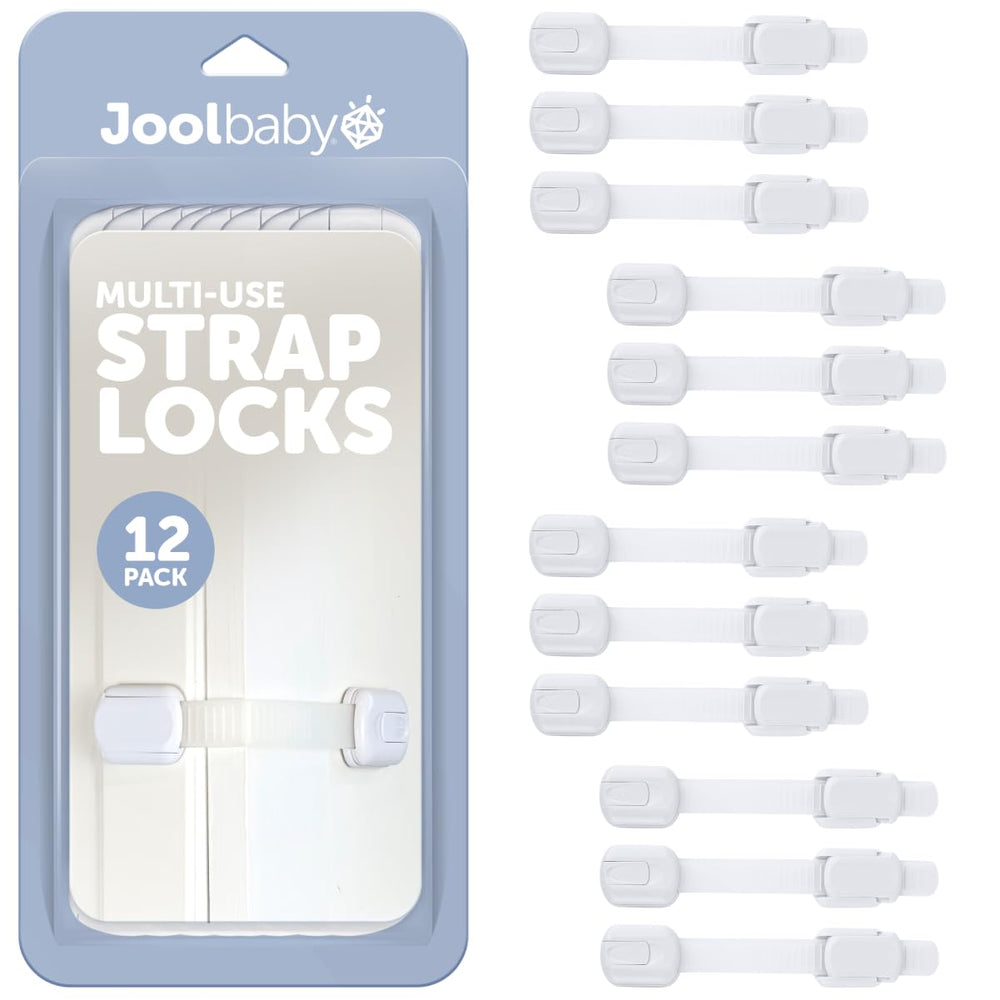 Jool Baby child safety strap locks securing a kitchen cabinet against curious toddlers.