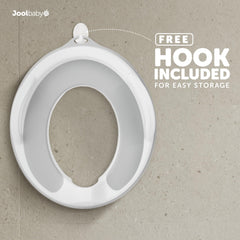 Jool Baby potty seat splash guard preventing spills during training.