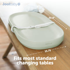 Safety strap supports baby during changes for added security.