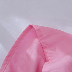 JSD pink crib skirt with split corners for easy on/off.