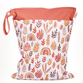 JuleLyn wet bag with rainbow leaf design, waterproof interior for beach gear and swimsuits.