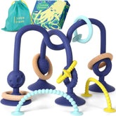 Jumble Dream Jangle teether with suction attached to high chair for mess-free mealtime.