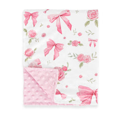 Jundetye baby blanket with pink rose design keeps baby cozy during naps.