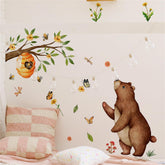 Jungle Animal Bear Wall Decals with green tree branch for a playful nursery backdrop.