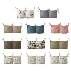 JUSTAUS crib organizer attached to bedrail keeps diapers within reach.