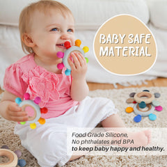 Kalovin wooden ring teether attached to clothing stays within reach for baby.