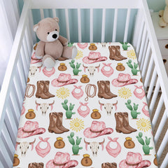 KASTLEE cowgirl-print baby sheet showcasing playful pattern for gender-neutral nurseries