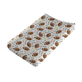 KASTLEE watercolor American football changing pad cover provides soft, breathable comfort.