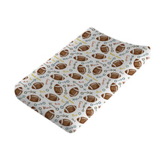 KASTLEE watercolor American football changing pad cover provides soft, breathable comfort.