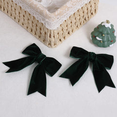KCHIES velvet dark green bow clip sideview showing clip mechanism.